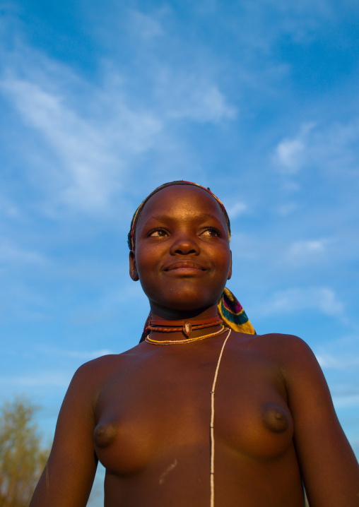 Portrait of a topless mucubal tribe young woman, Namibe Province, Virei, Angola
