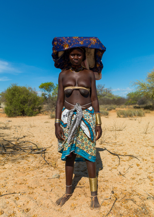 Mucubal tribe woman wearing a colorful headwear, Namibe Province, Virei, Angola
