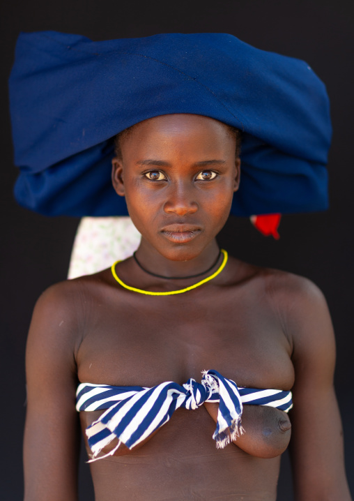 Mucubal tribe woman wearing a blue headwear, Namibe Province, Virei, Angola