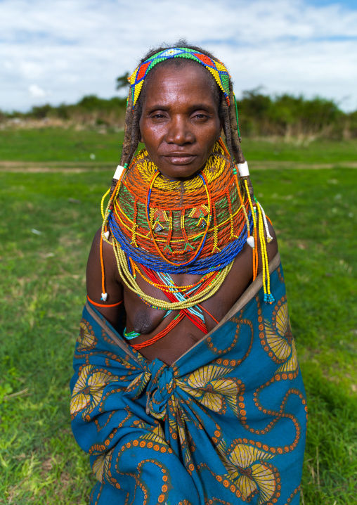 Mumuhuila tribe woman portrait in a field, Huila Province, Chibia, Angola