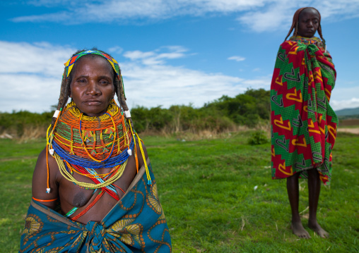 Mumuhuila tribe women in a field, Huila Province, Chibia, Angola