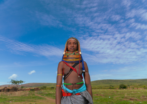 Portrait of a Mumuhuila tribe woman in a field, Huila Province, Chibia, Angola