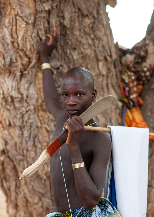 Portrait of a Mucubal tribe man with his machete, Namibe Province, Virei, Angola