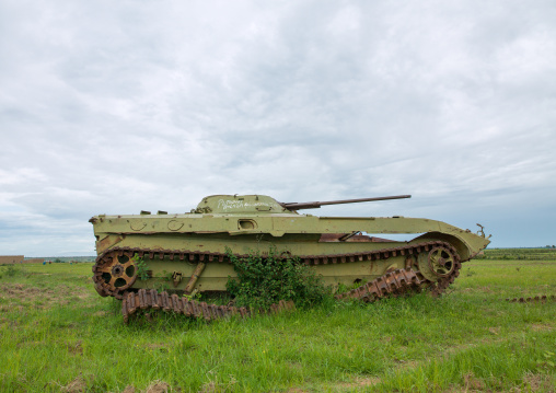 Tank wreck from the civil war in a field, Huila Province, Caconda, Angola