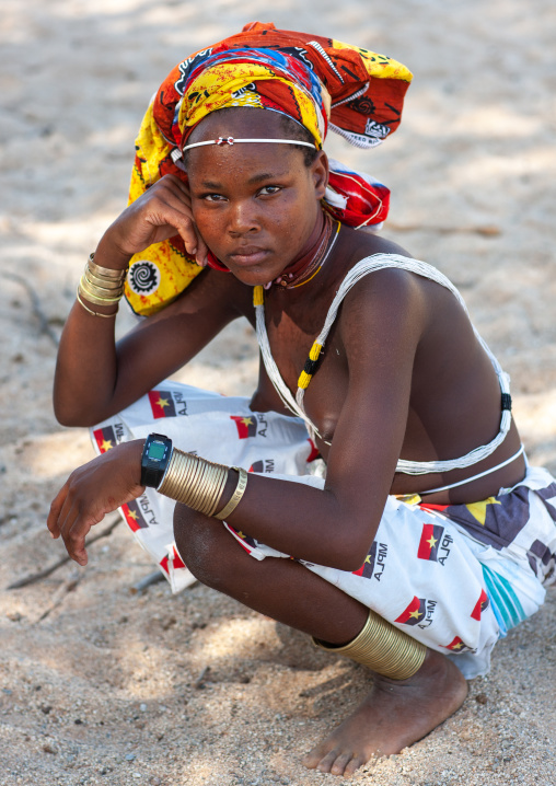 Portrait of a Mucubal tribe young woman wearing a colorful headwear, Namibe Province, Virei, Angola