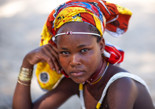 Portrait of a Mucubal tribe young woman wearing a colorful headwear, Namibe Province, Virei, Angola
