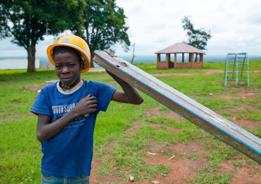 Angolan boy with a yellow safety helmet, Malanje Province, Calandula, Angola