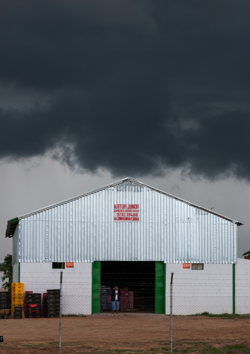 Warehouse under a stormy sky, Huila Province, Chibia, Angola