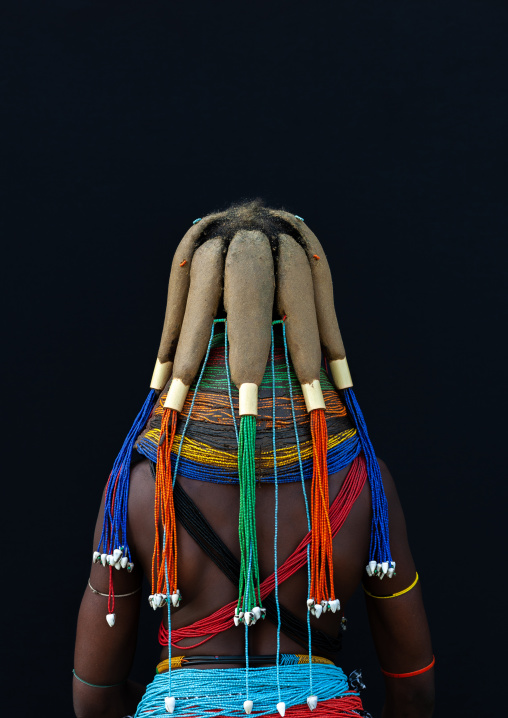Rear view of a Mumuhuila tribe woman, Huila Province, Chibia, Angola