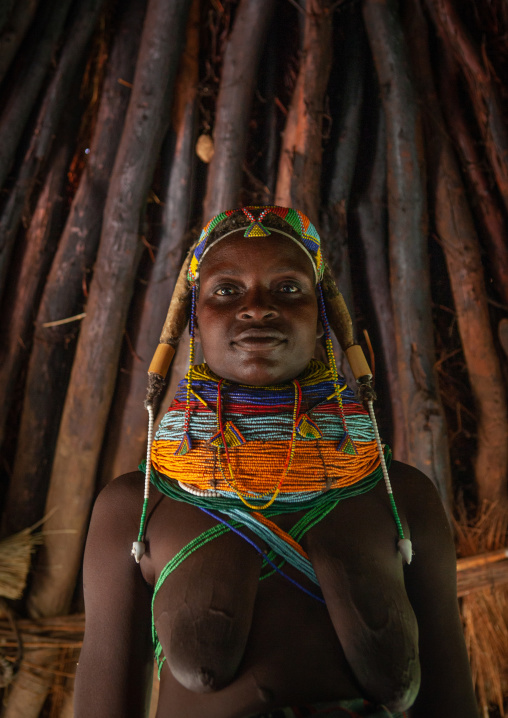 Mumuhuila tribe woman inside her hut, Huila Province, Chibia, Angola