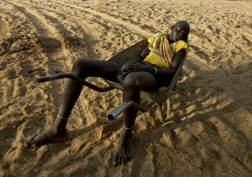 Mucubal Boy Sleeping In A Wheelbarrow, Virie Area, Angola