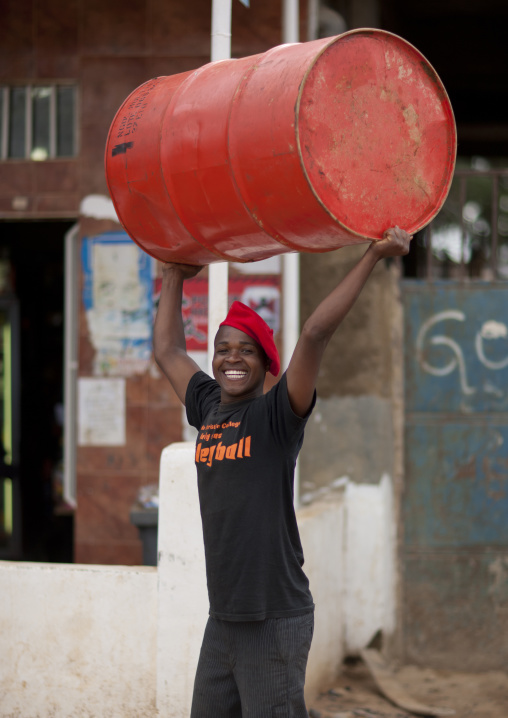 Smiling Man Lifting A Barrel Over His Head, Huambo, Angola