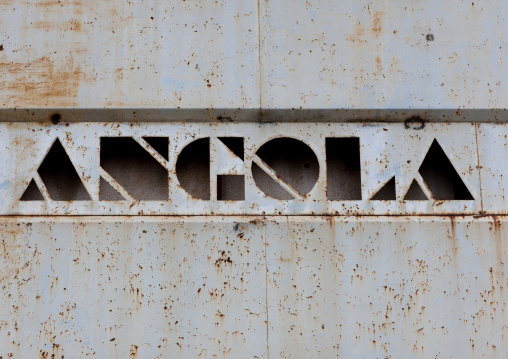 Rusty Sign Of The Former Trade Bank In Vila Nova, Angola