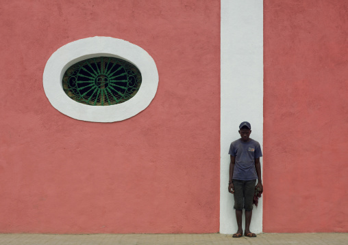 Boy In A Front Of A Pink Facade In Benguela, Angola