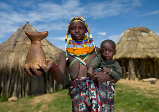 Mwila Woman With Her Son In Her Arms Showing A Headrest, Angola