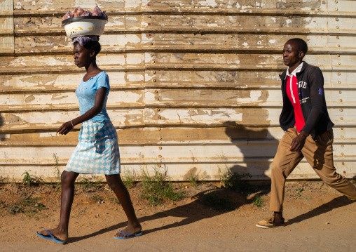 Angolan man and woman walking in the street, Huila Province, Lubango, Angola