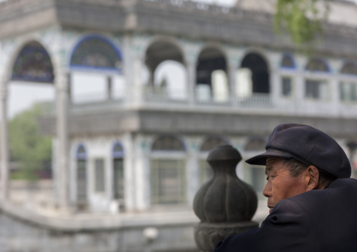 Chinese Man In Front Of Marble Boat In Summer Palace, Beijing China