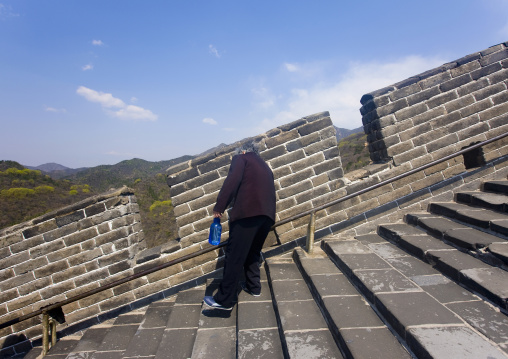 Old Woman Going Down The Great Wall, Beijing, China
