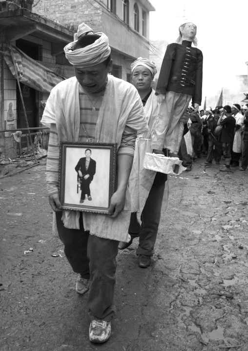Man Holding The Picture Of The Dead During Funeral Procession, Yuanyang, Yunnan Province, China