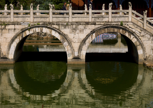 Triple Arched Bridge With Water Reflections In Yuantong Temple, Kunming, Yunnan Province
