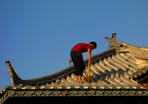 Man Repairing A Roof, Jianshui, Yunnan Province, China