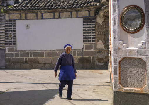 Old Woman Walking In The Streets, Xizhou, Yunnan Province, China
