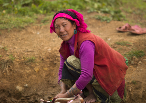 Woman With Tatooed Arms Working In A Field, Yongsheng, Yunnan Province, China