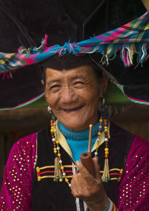 Yi Tribal Woman In Traditional Clothes, Yongsheng, Yunnan Province, China