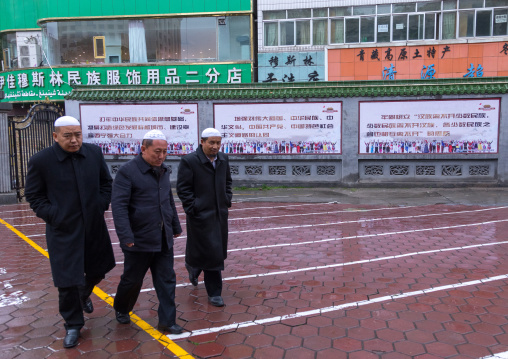 Muslim men going to pray to Dongguan grand mosque, Qinghai province, Xining, China