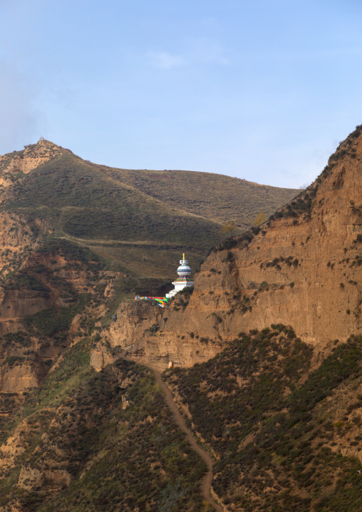 Stupa on a cliff in Shachong monastery, Qinghai Province, Wayaotai, China