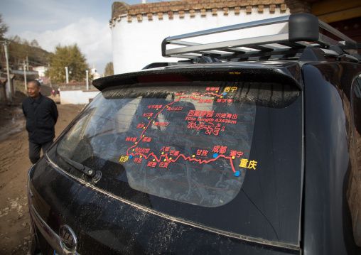 Carwith the map of tibet on its windshield in Shachong monastery, Qinghai Province, Wayaotai, China