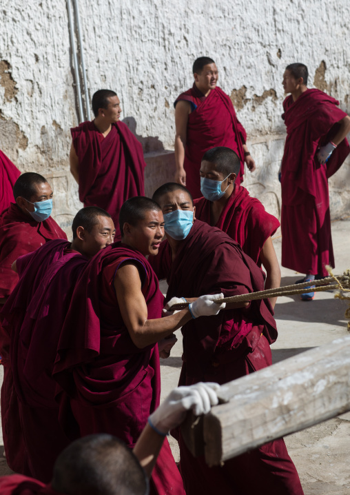 Monks preparing the painting of a temple in Rongwo monastery, Tongren County, Longwu, China