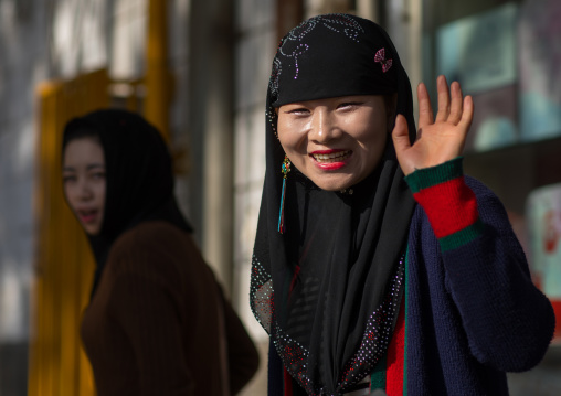 Hui muslim woman smiling in the street, Gansu province, Linxia, China