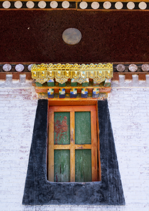 Typical tibetan window on a temple in Rongwo monastery, Tongren County, Longwu, China