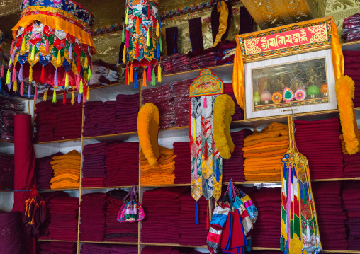 Tibetan shop selling robes and hats for the monks near Rongwo monastery, Tongren County, Longwu, China