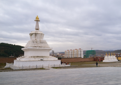 Stupa in front of the modern town in Hezuo monastery, Gansu province, Hezuo, China