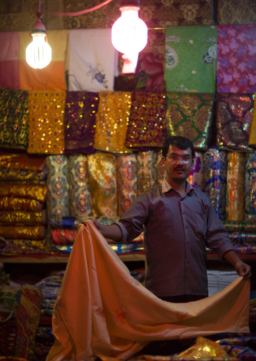 Uyghur Cloth Seller In the bazaar, Hotan, Xinjiang Uyghur Autonomous Region, China