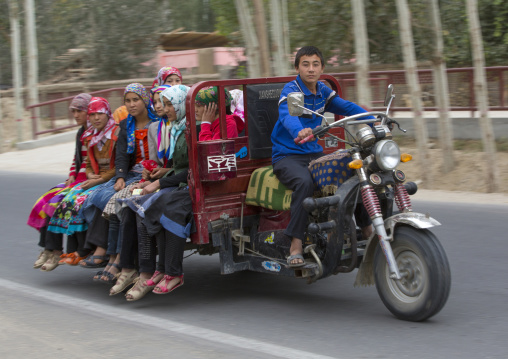 Uyghur Teenager Driving Girls In A Cart, Hotan, Xinjiang Uyghur Autonomous Region, China