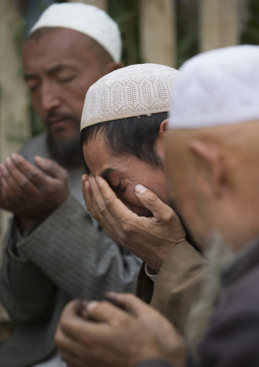 Uyghur Sufi Men Praying At Imam Asim Tomb In The Taklamakan Desert, Xinjiang Uyghur Autonomous Region, China