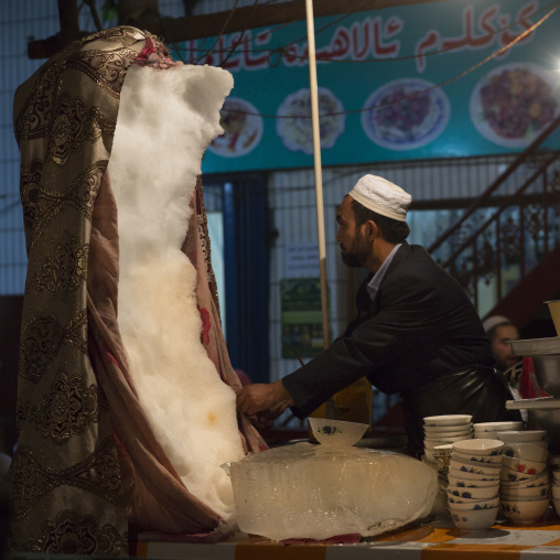 Uyghur Man Selling Ice cream In Night Market, Hotan, Xinjiang Uyghur Autonomous Region, China