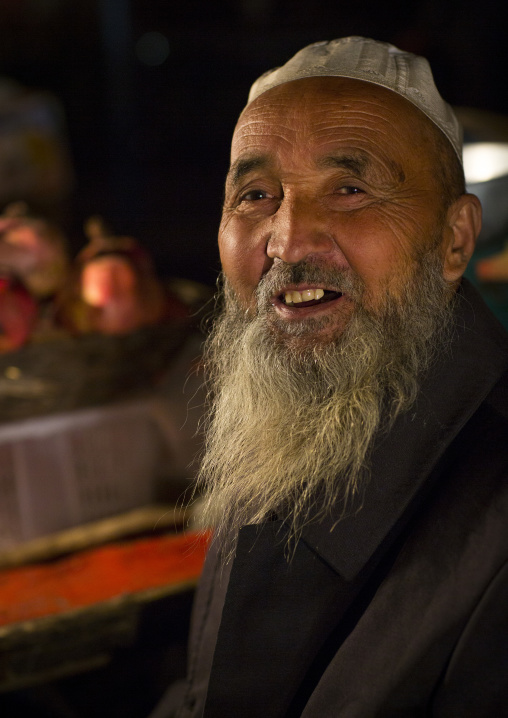 Smiling Uyghur Man In Night Market, Hotan, Xinjiang Uyghur Autonomous Region, China
