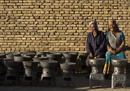 Smiling Uyghur Couple Selling Wood Stoves, Yarkand, Xinjiang Uyghur Autonomous Region, China