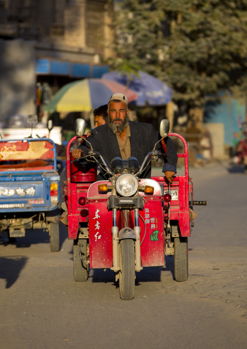 Uyghur Man Driving A Motorized Cart, Yarkand, Xinjiang Uyghur Autonomous Region, China