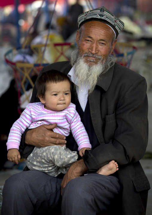 Old Uyghur Man And Baby, Serik Buya Market, Yarkand, Xinjiang Uyghur Autonomous Region, China