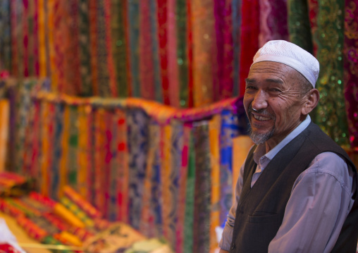 Uyghur Man Selling Cloth In Serik Buya Market, Yarkand, Xinjiang Uyghur Autonomous Region, China