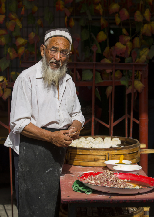 Old Uyghur Man Making Dumplings, Serik Buya Market, Yarkand, Xinjiang Uyghur Autonomous Region, China