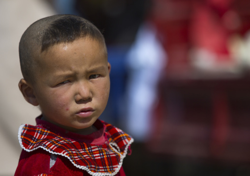 Uyghur boy with new haircut, Serik Buya Market, Yarkand, Xinjiang Uyghur Autonomous Region, China