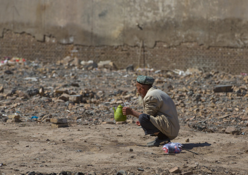 Old Uyghur Man making ablutions, Old Town Of Kashgar, Xinjiang Uyghur Autonomous Region, China