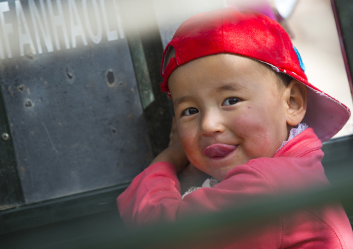 Uyghur Kid smiling, Opal Village Market, Xinjiang Uyghur Autonomous Region, China