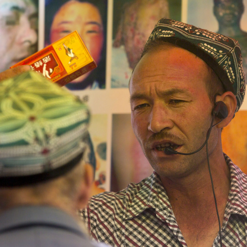 Uyghur Man Sellin Cough Syrup, Opal Village Market, Xinjiang Uyghur Autonomous Region, China